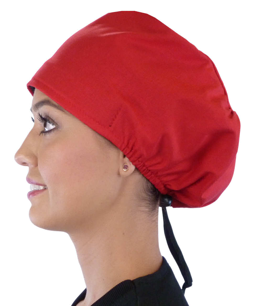 Side facing image of a woman in scrubs wearing a Red Euro Style Riley Comfort Scrub Cap.