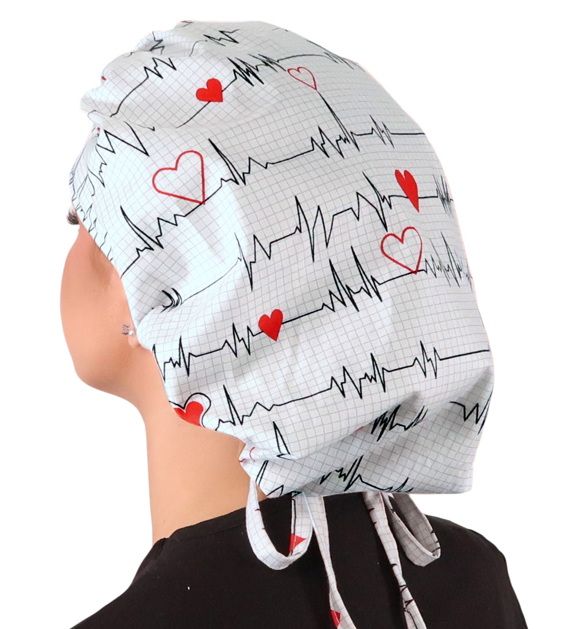 Side Facing Untied View of a Woman Wearing a Tied Back Banded Bouffant Ponytail Surgical Scrub Cap - Heartbeats on White Patterned Fabric