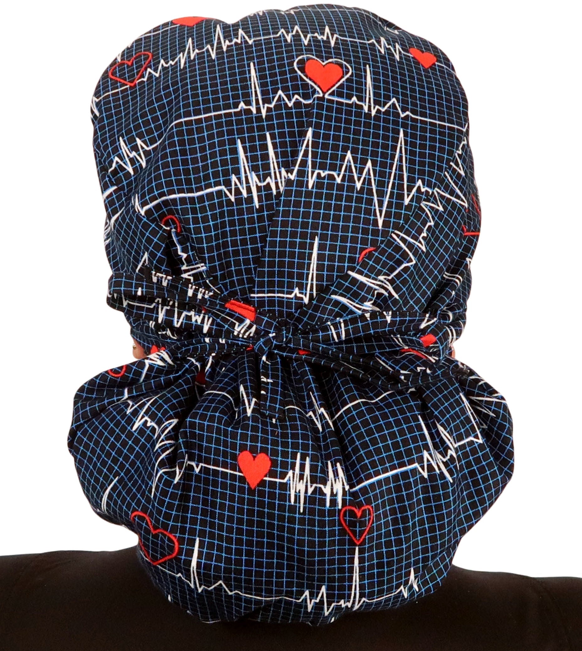 Back facing image tied of a woman in scrubs wearing a Big Hair Ponytail Scrub Cap with a Heartbeats on Navy pattern.