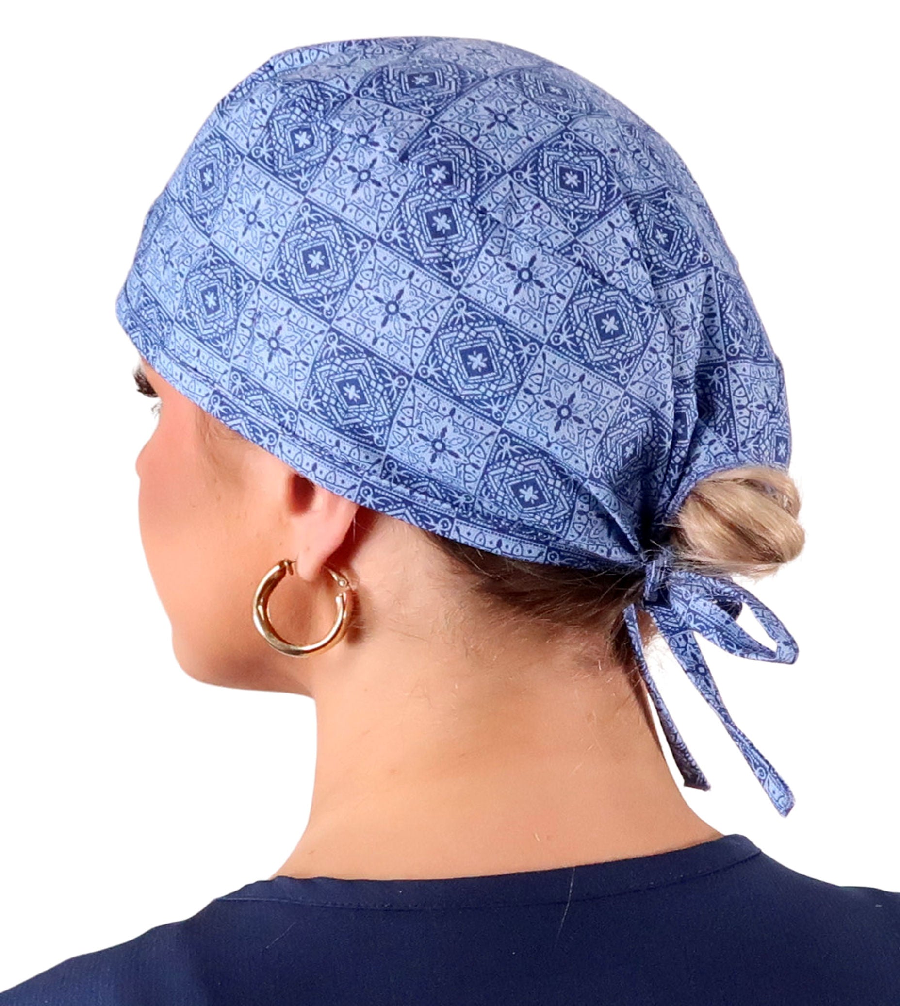 Side Facing View of a Woman Wearing a Classic Cotton Surgical Scrub Cap - Tuscan Blue Tiles Pattern.