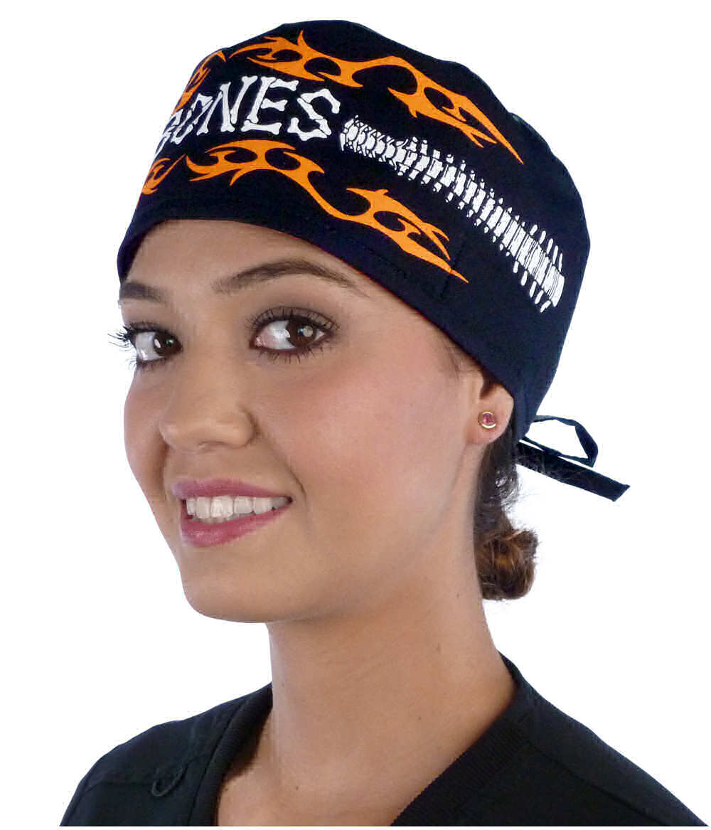 Front facing image of a woman in scrubs wearing a Classic Surgical Scrub Cap in a Bones on Black pattern.