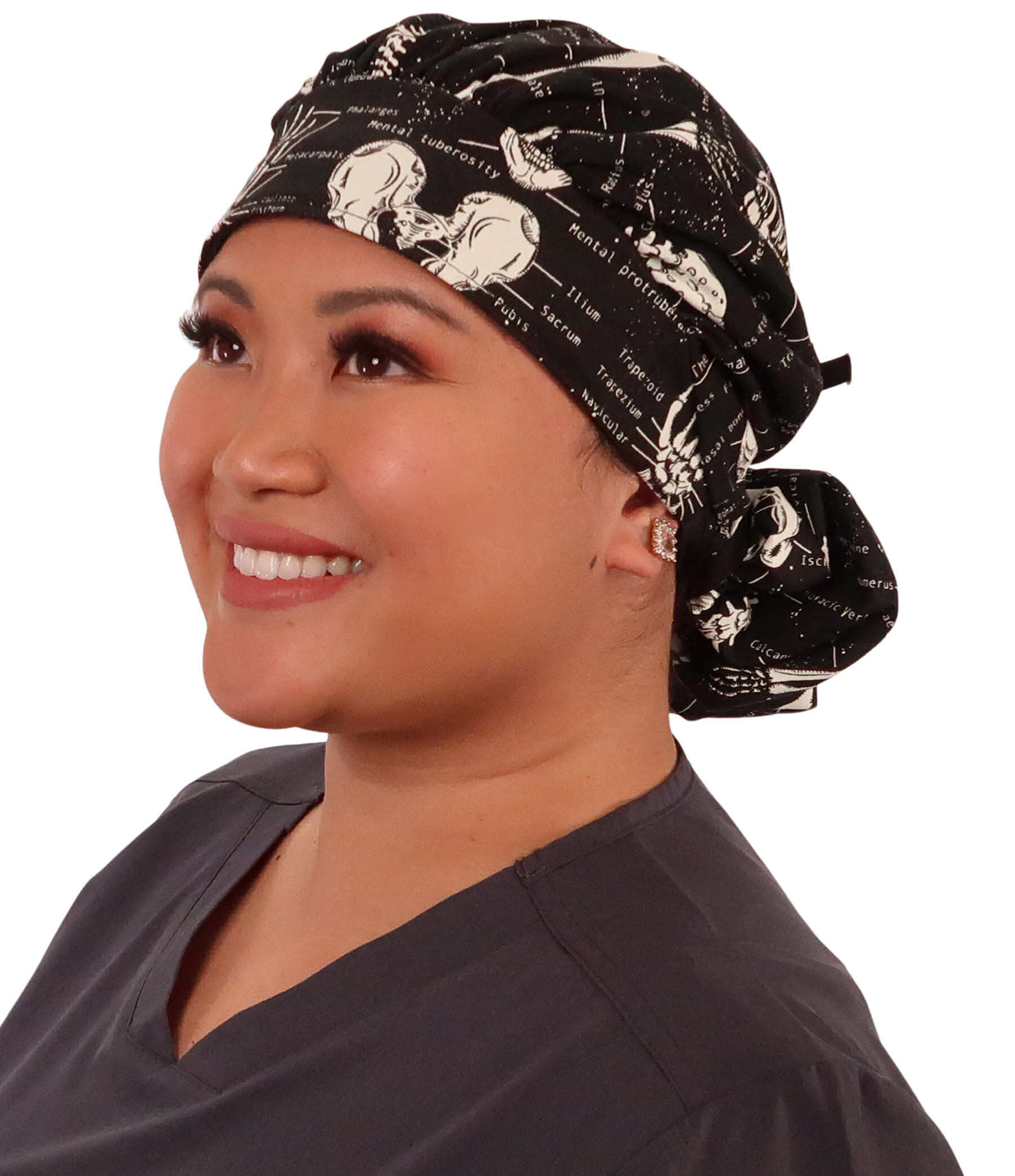 Front Facing Tied View of a Woman Wearing a Tied Back Banded Bouffant Ponytail Surgical Scrub Cap - Human Body Skeletons Patterned Fabric with Black Ties