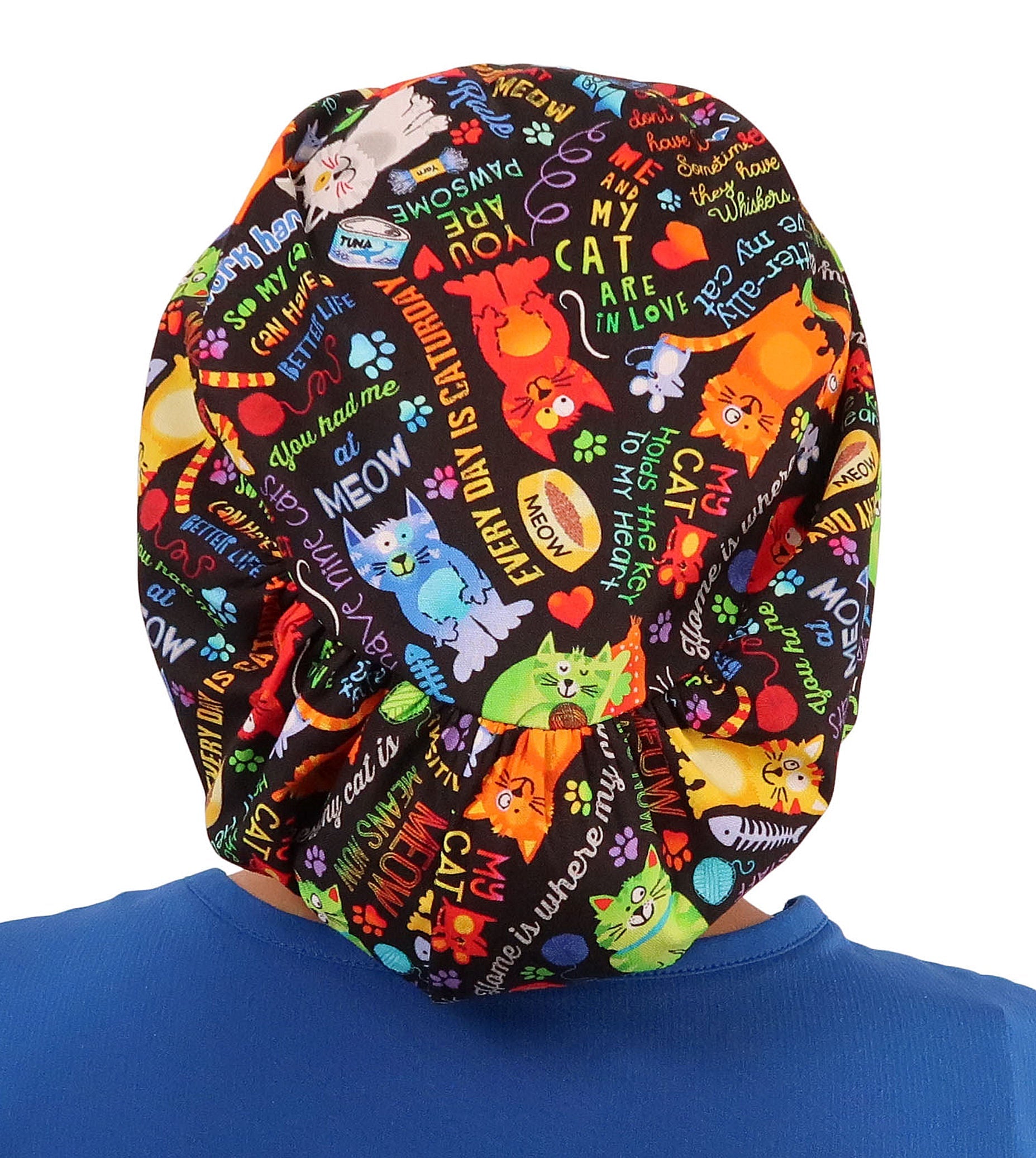 Back facing image of a woman in scrubs wearing a PURRfect Kitties Euro Style Riley Comfort Scrub Cap.