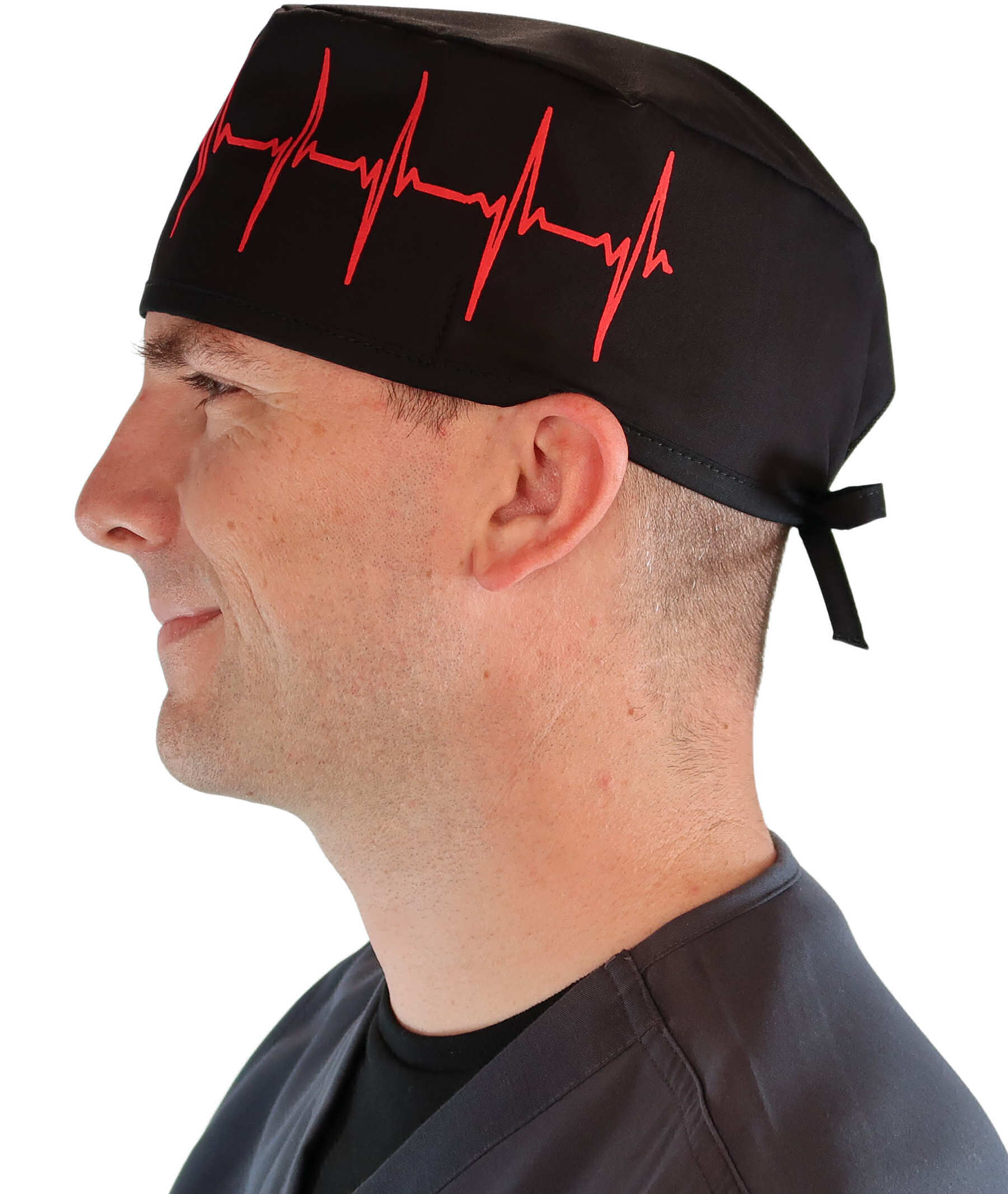 Side Facing View of a man Wearing a Classic Cotton Surgical Scrub Cap - Red EKG (Heartbeat) on Black Pattern.
