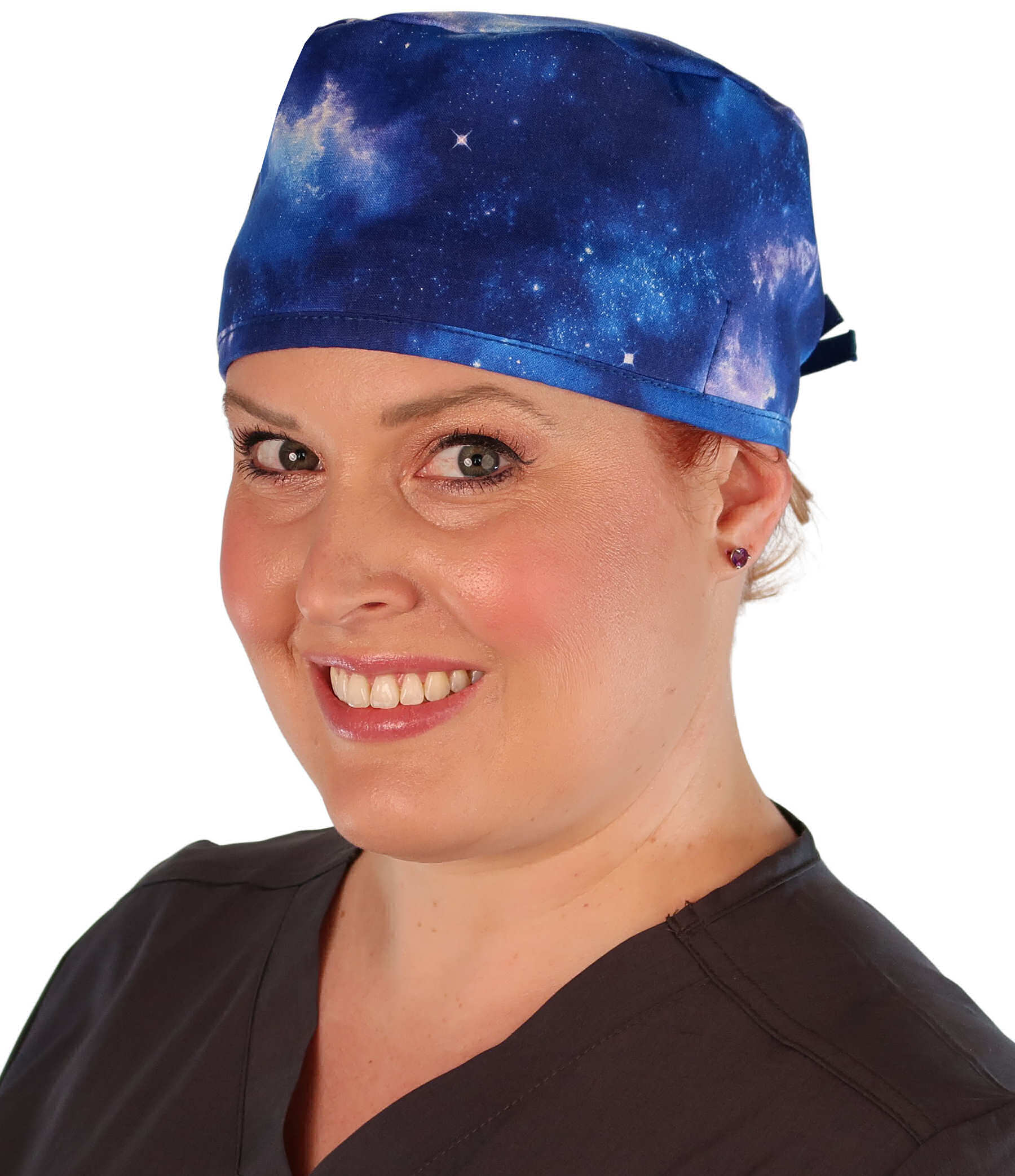 Front facing image of a woman in scrubs wearing a Classic Surgical Scrub Cap with a Starry Sky pattern.
