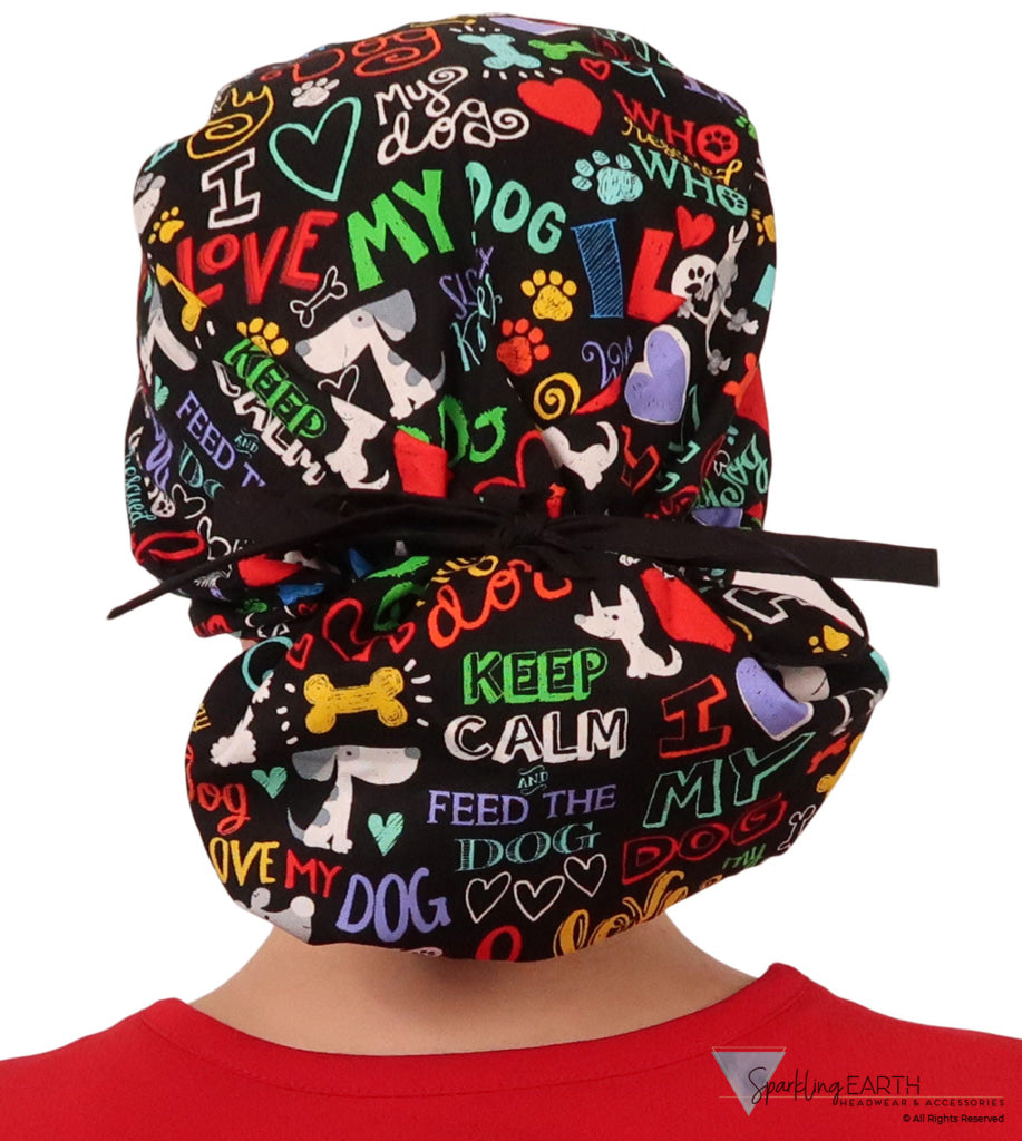 Back facing tied image of a woman in scrubs wearing a Big Hair Ponytail Scrub Cap with a I Love My Dog pattern, and black ties to hold the scrub cap in place