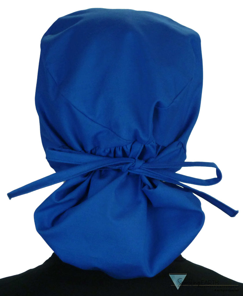 Back facing tied image of a woman in scrubs wearing a Royal Big Hair Ponytail Scrub Cap and royal ties to hold the scrub cap in place.