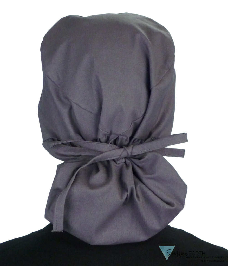 Back facing tied image of a woman in scrubs wearing a Grey Big Hair Ponytail Scrub Cap and grey ties to hold the scrub cap in place.