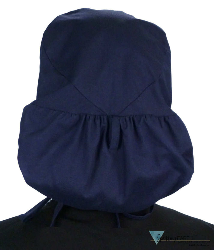 Back facing untied image of a woman in scrubs wearing a Navy Big Hair Ponytail Scrub Cap and navy ties to hold the scrub cap in place.