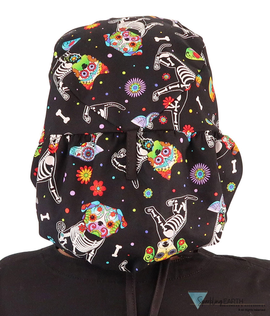 Back facing untied image of a woman in scrubs wearing a Big Hair Ponytail Scrub Cap with a X-Ray Dogs pattern, and black ties to hold the scrub cap in place.