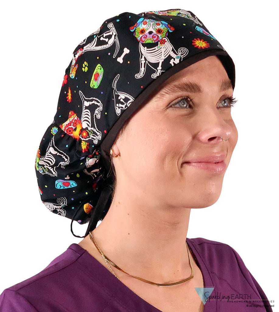 Side facing untied image of a woman in scrubs wearing a Big Hair Ponytail Scrub Cap with a X-Ray Dogs pattern, and black ties to hold the scrub cap in place.