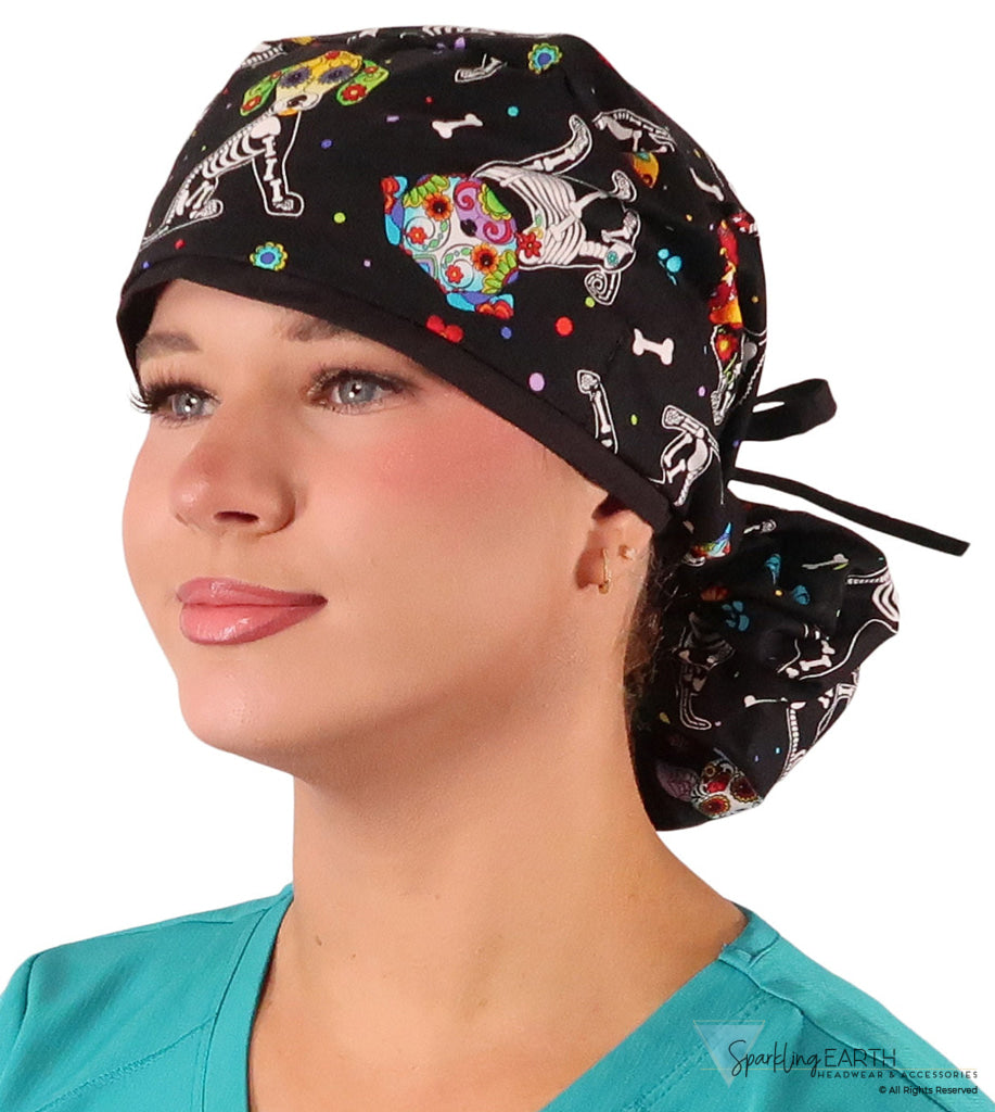 Front facing tied image of a woman in scrubs wearing a Big Hair Ponytail Scrub Cap with a X-Ray Dogs pattern, and black ties to hold the scrub cap in place.