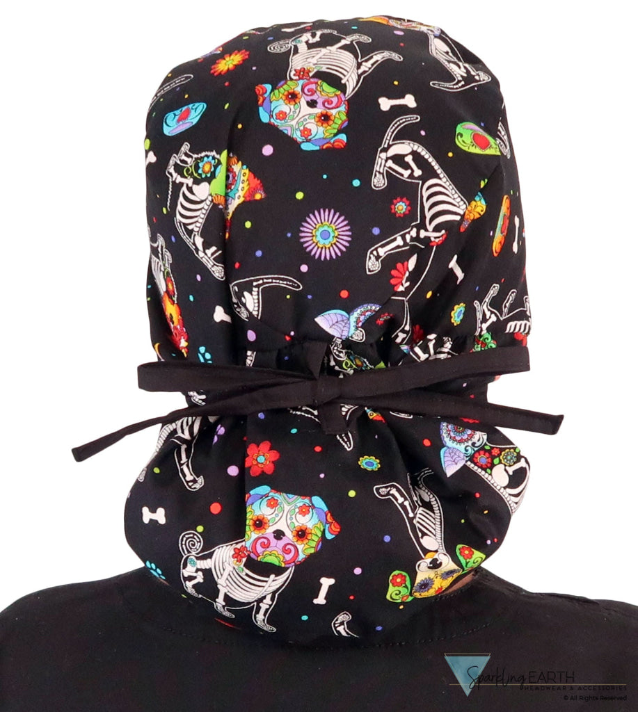 Back facing tied image of a woman in scrubs wearing a Big Hair Ponytail Scrub Cap with a X-Ray Dogs pattern, and black ties to hold the scrub cap in place.