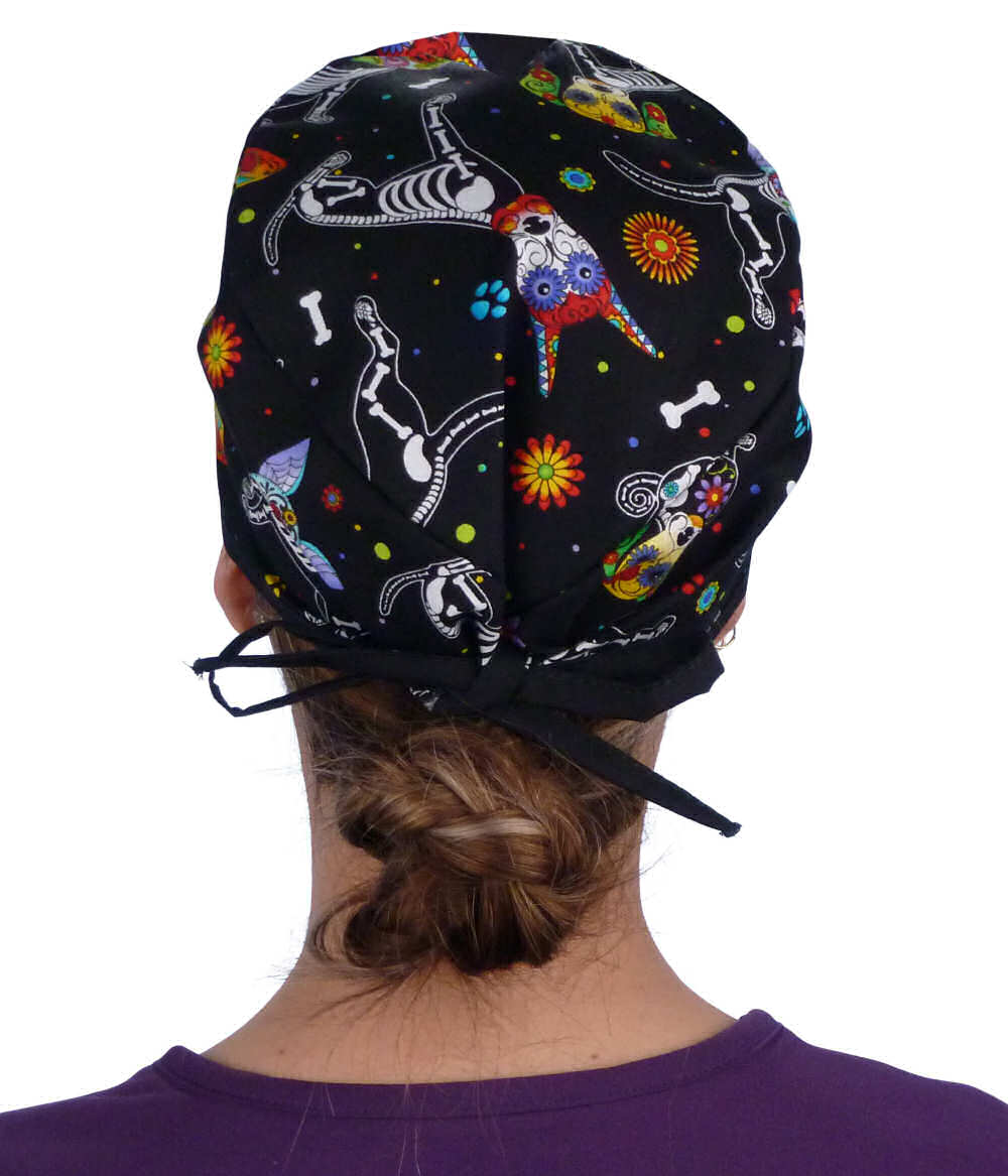 Back facing image of a woman in scrubs wearing a Classic Surgical Scrub Cap in a X Ray Dogs with black ties pattern.