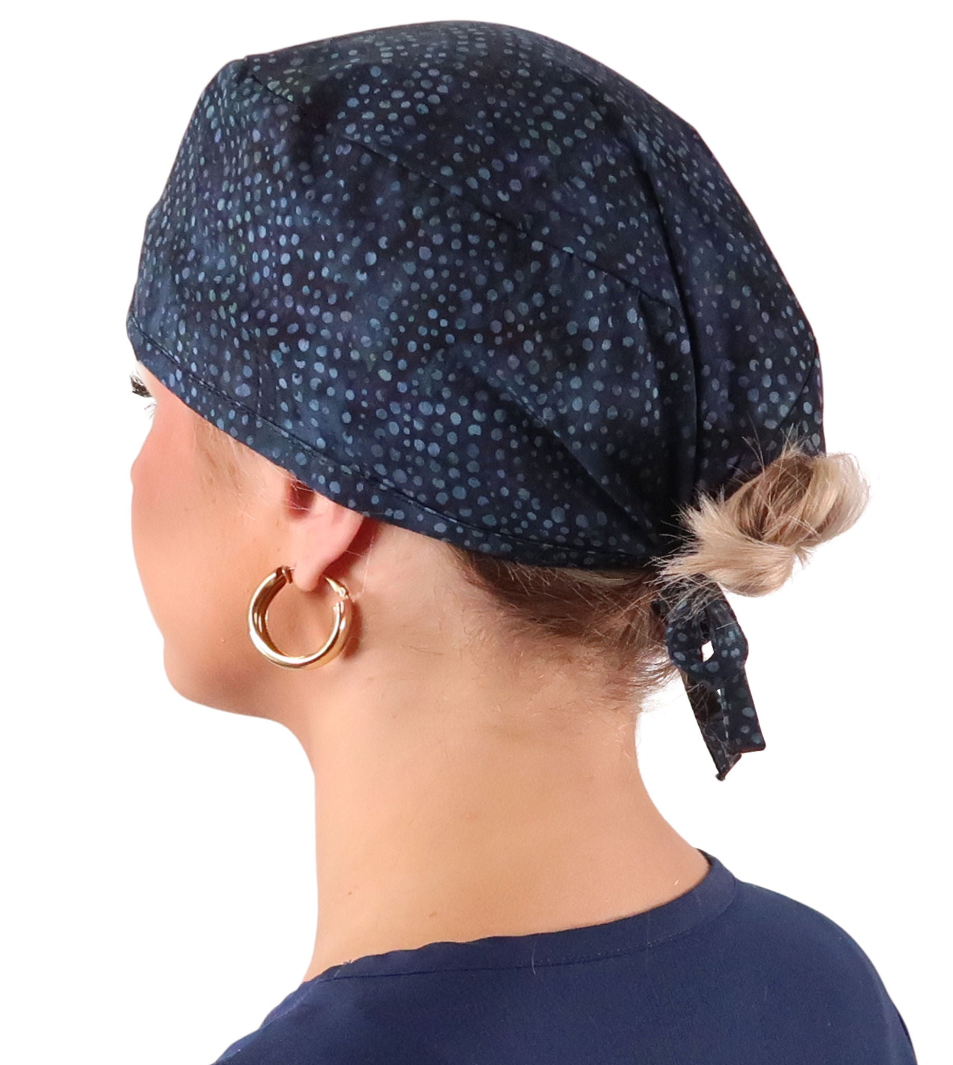 Side Facing View of a Woman Wearing a Classic Cotton Surgical Scrub Cap - Midnight Navy Batik Pattern.