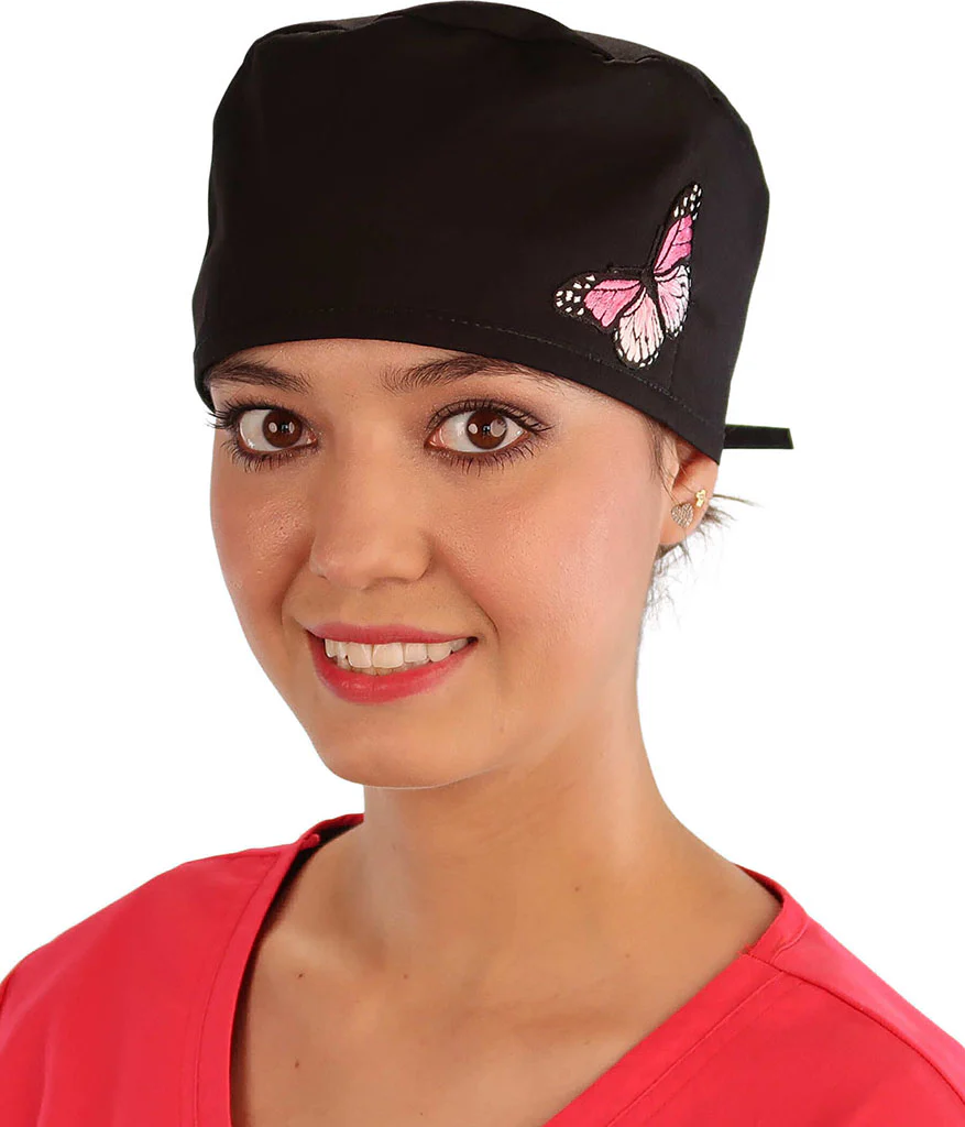 Front Facing View of a Woman Wearing a Classic Cotton Surgical Scrub Cap - Black Fabric with Pink Butterfly Patch.