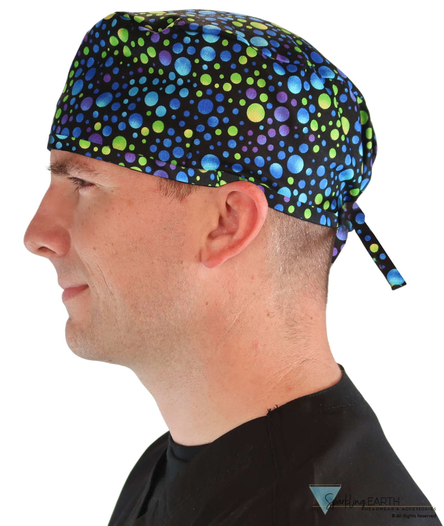 Side facing image of a man in scrubs wearing a Classic Surgical Scrub Cap in a Blue, Green and Purple Dots pattern.