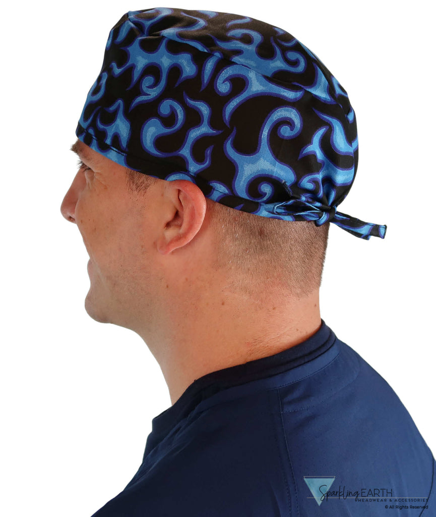 Side facing image of a man in scrubs wearing a Classic Surgical Scrub Cap in Liquid Blue Flames pattern.