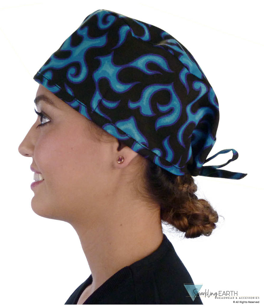 Side facing image of a woman in scrubs wearing a Classic Surgical Scrub Cap in Liquid Blue Flames pattern.