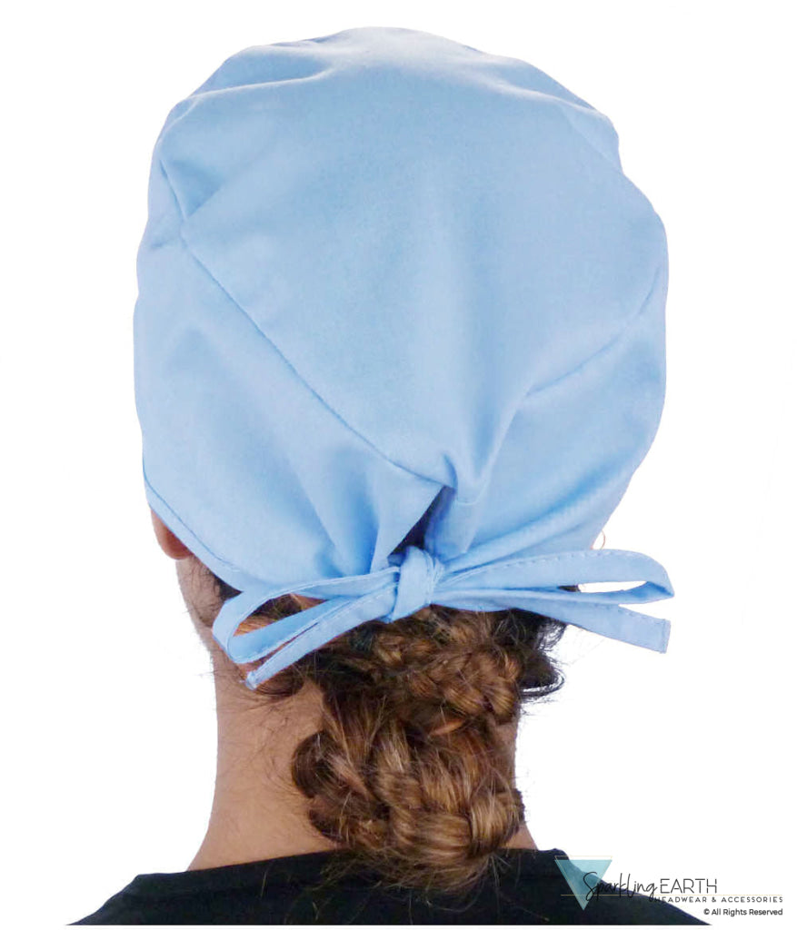 Back Facing View of a Woman Wearing a Classic Cotton Surgical Scrub Cap - Solid Sky Light Scrub Cap