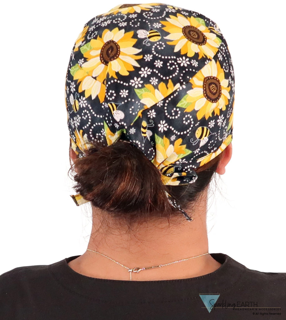 Back facing image of a woman in scrubs wearing a Classic Surgical Scrub Cap in a  Sunflowers on Black pattern.