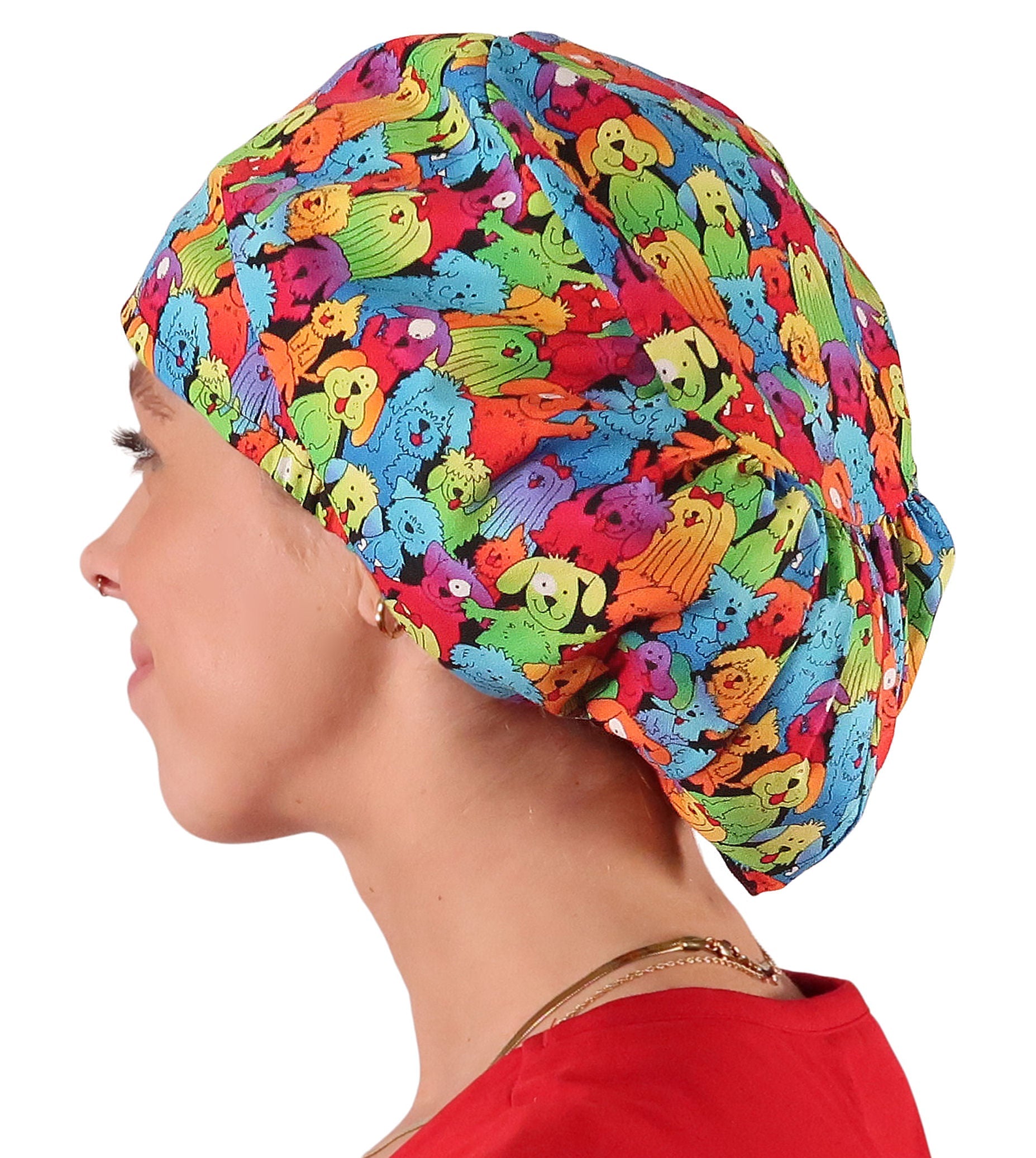 Side facing image of a woman in scrubs wearing a Prismatic Pooch Party Euro Style Riley Comfort Scrub Cap.