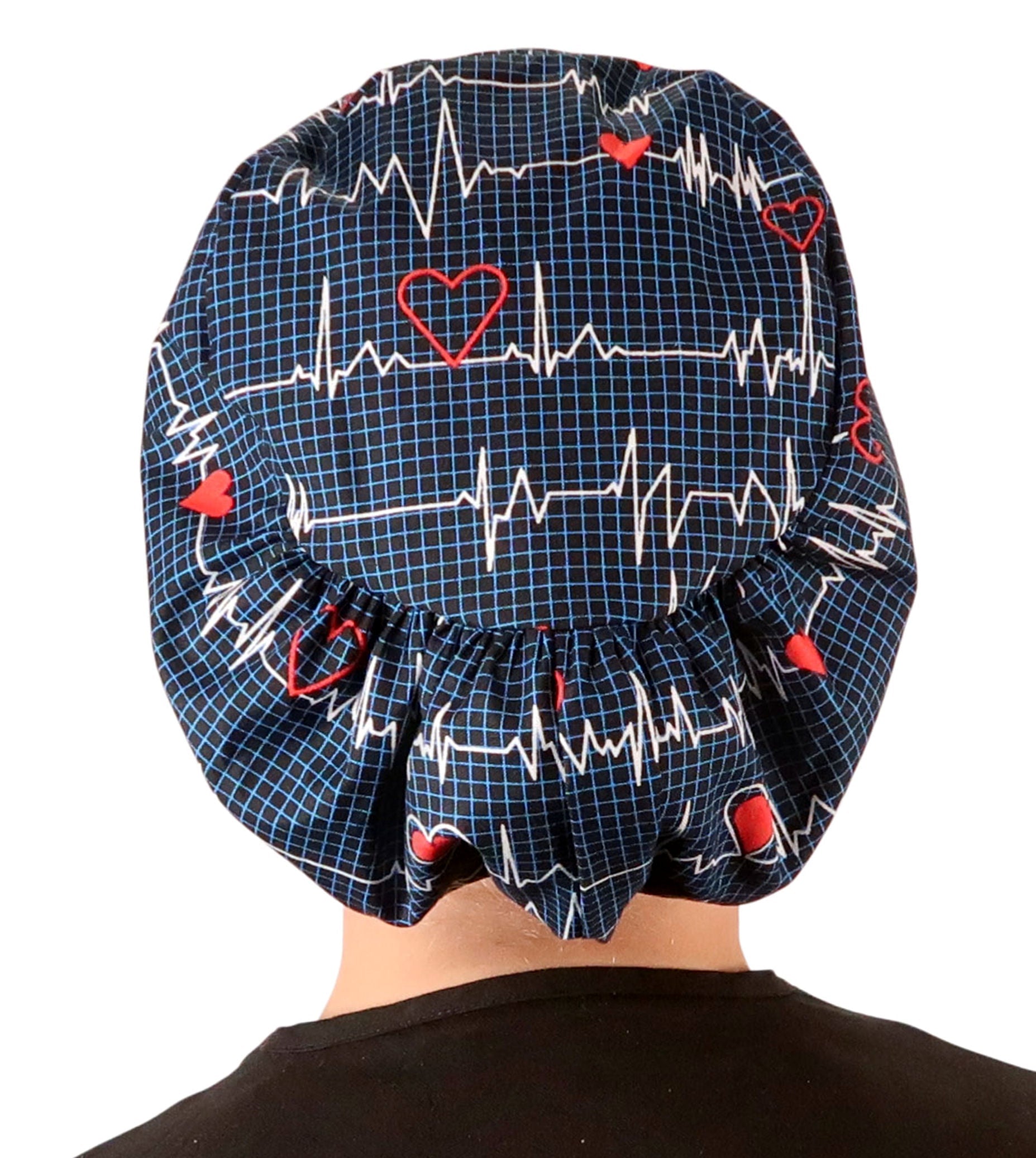 Back facing image of a woman in scrubs wearing a Heartbeats on Navy Euro Style Riley Comfort Scrub Cap.