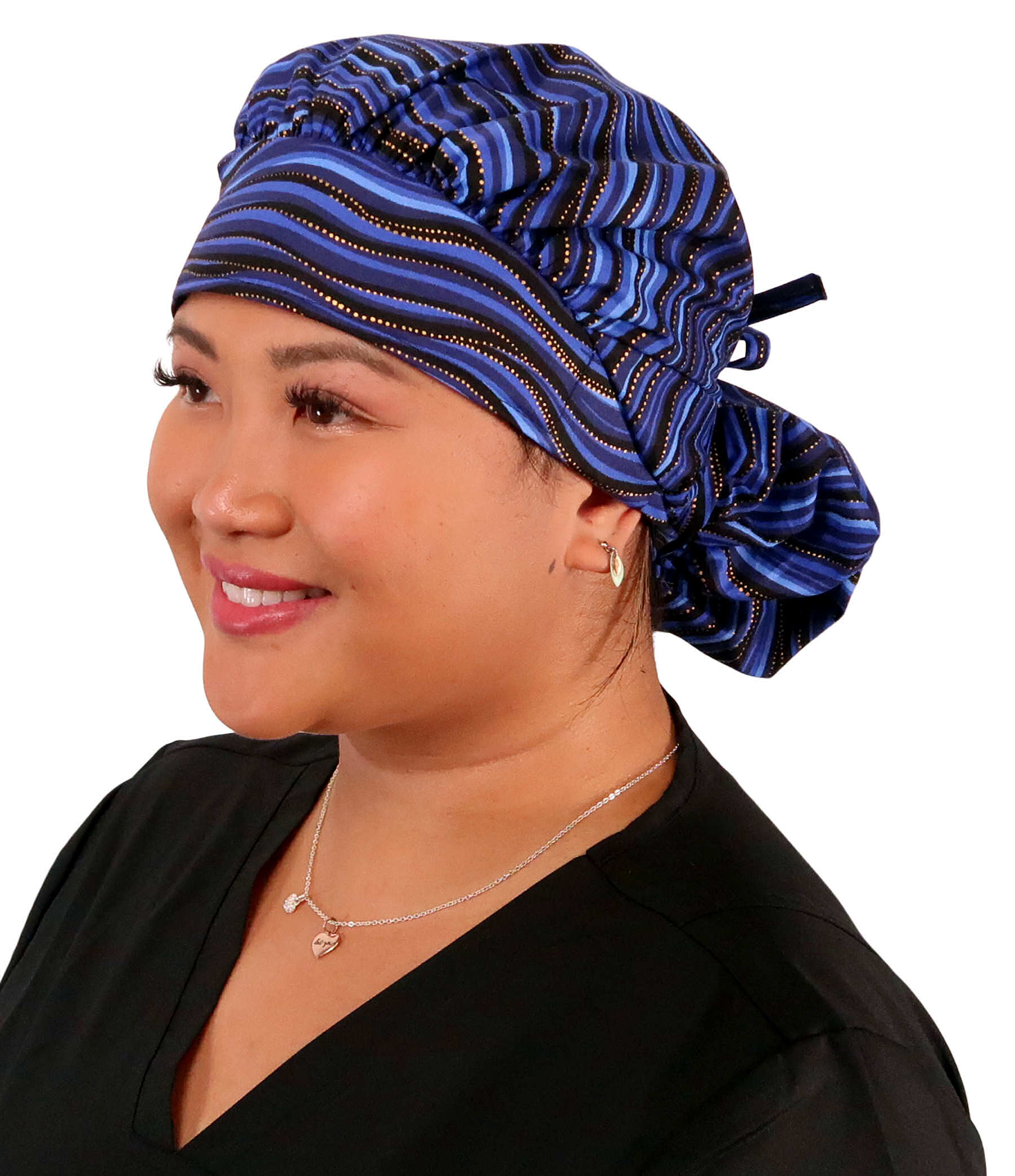 Front Facing Tied View of a Woman Wearing a Banded Bouffant Ponytail Surgical Scrub Cap - Waves of Blue Patterned Fabric 