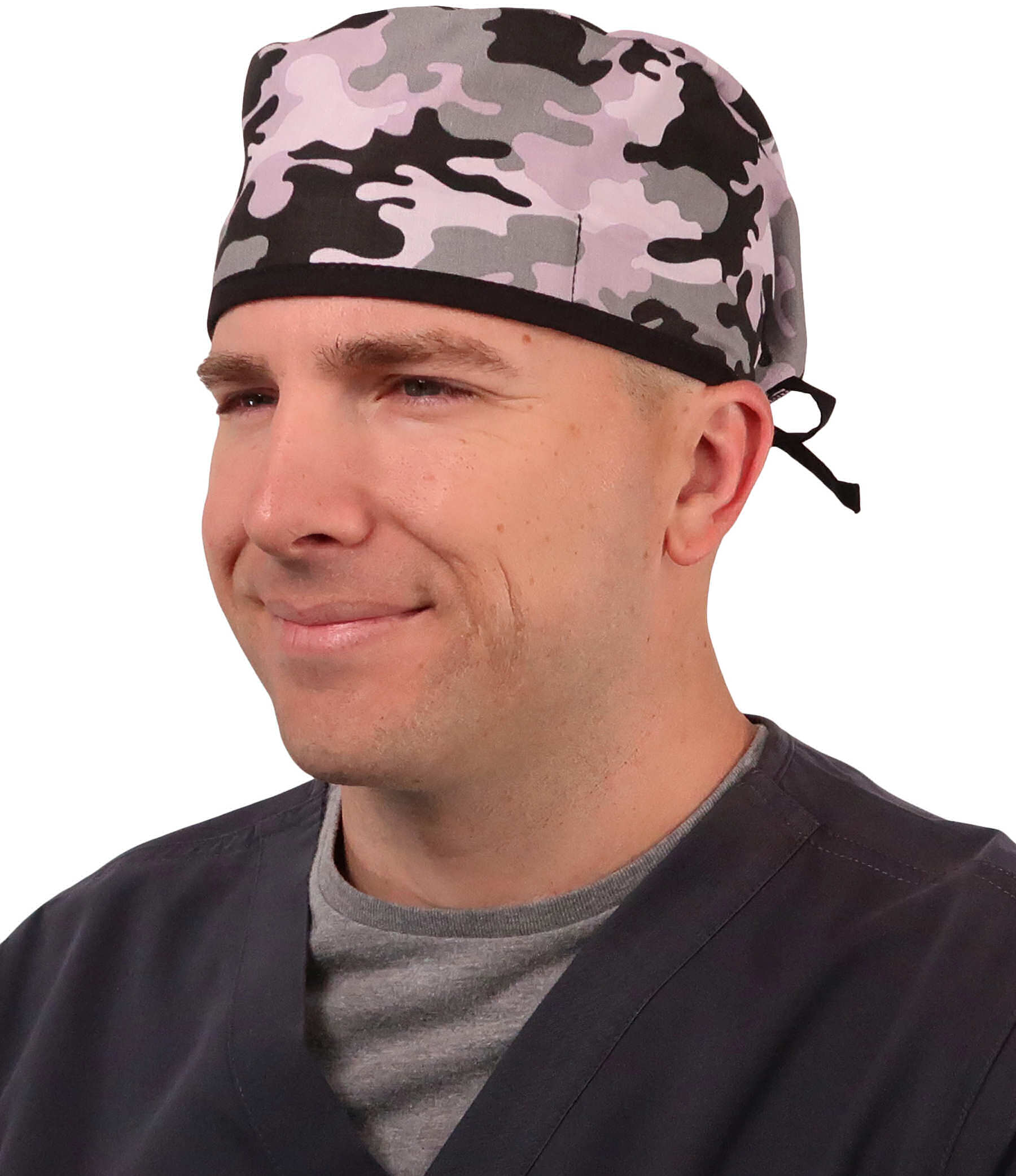 Front Facing View of a Man Wearing a Classic Cotton Surgical Scrub Cap - Kickin Camo Black and Grey with Black Ties Pattern.