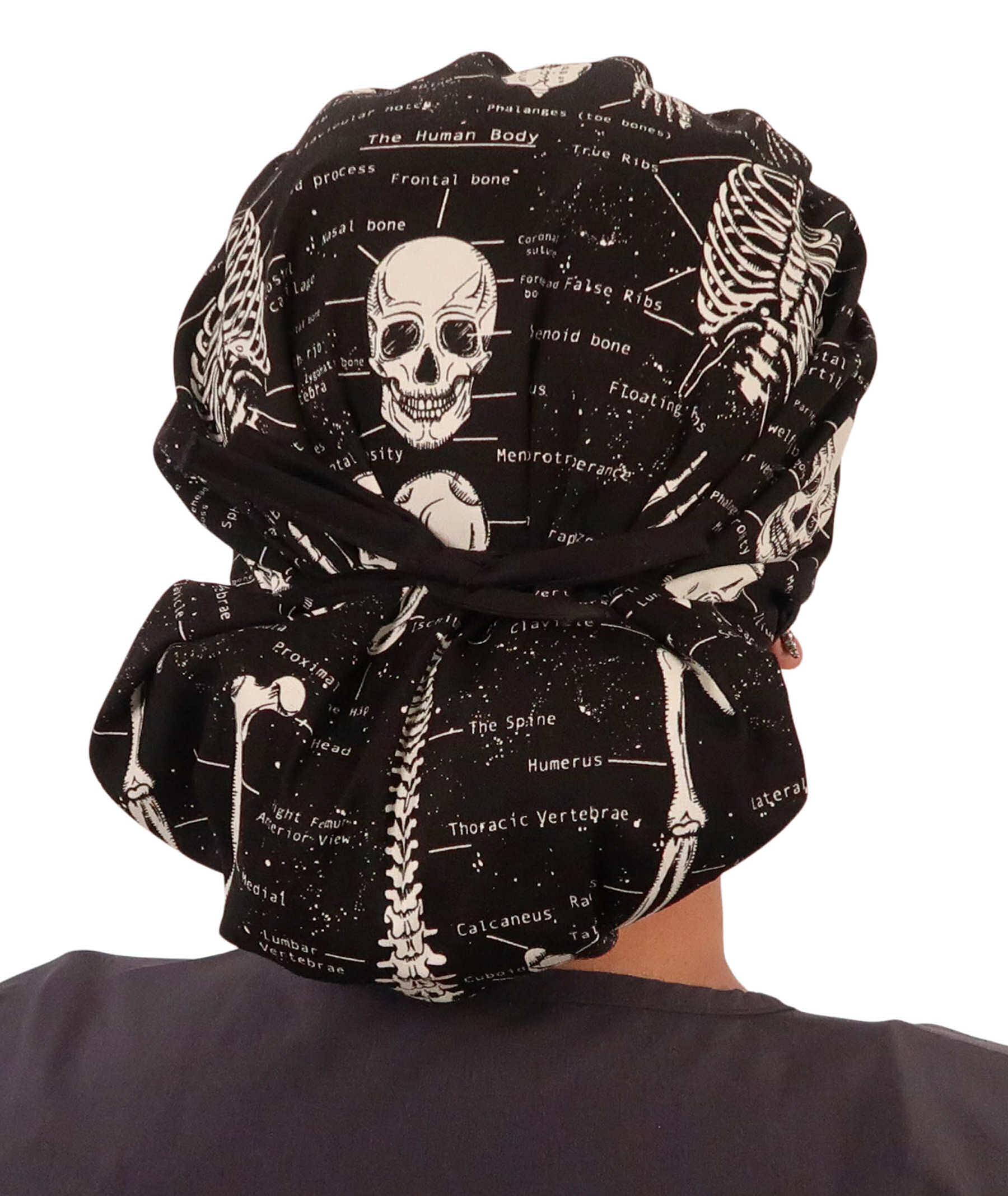 Back Facing Tied View of a Woman Wearing a Tied Back Banded Bouffant Ponytail Surgical Scrub Cap - Human Body Skeletons Patterned Fabric with Black Ties