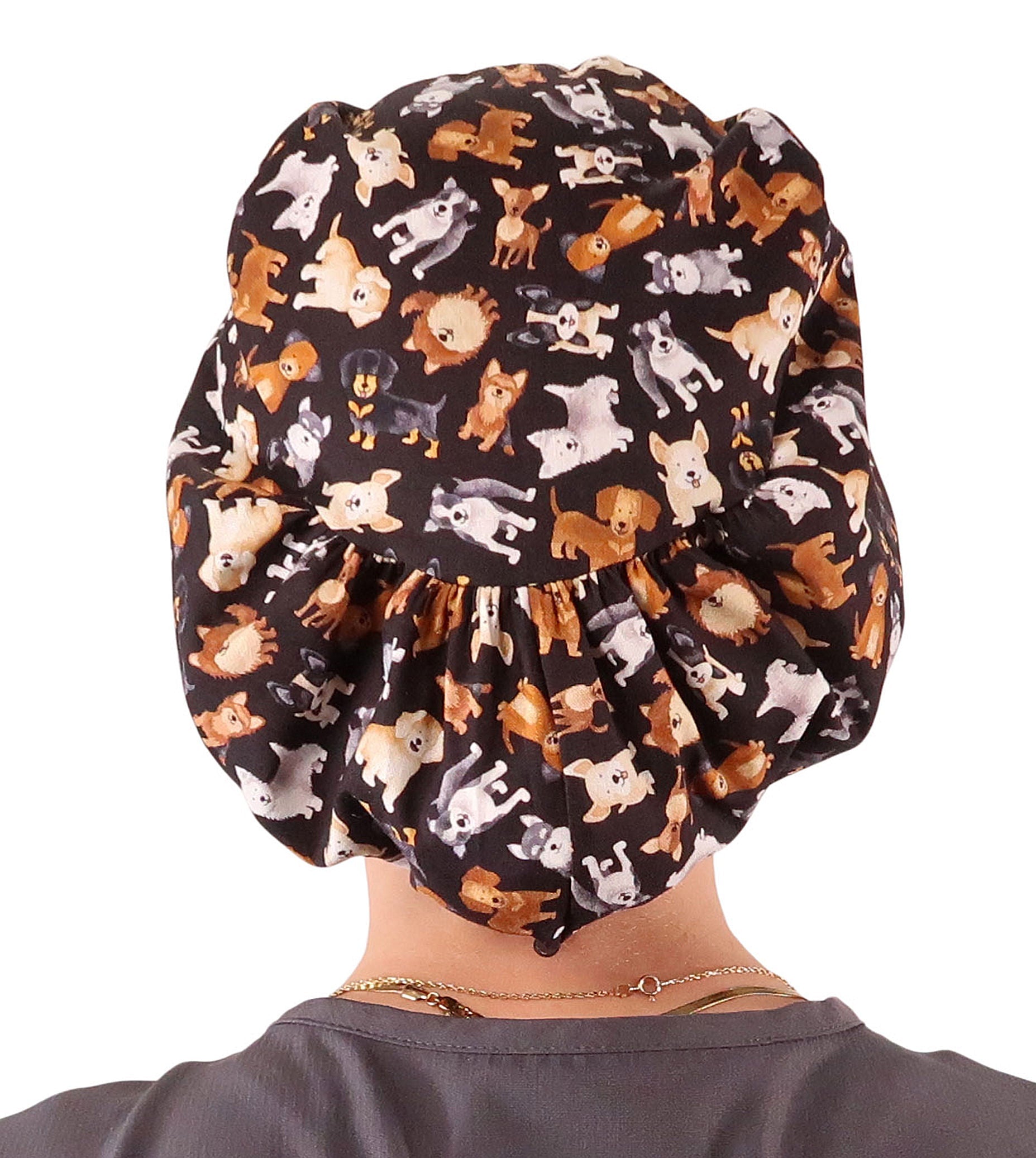Back facing image of a woman in scrubs wearing a Puppy Parade Dogs Euro Style Riley Comfort Scrub Cap.