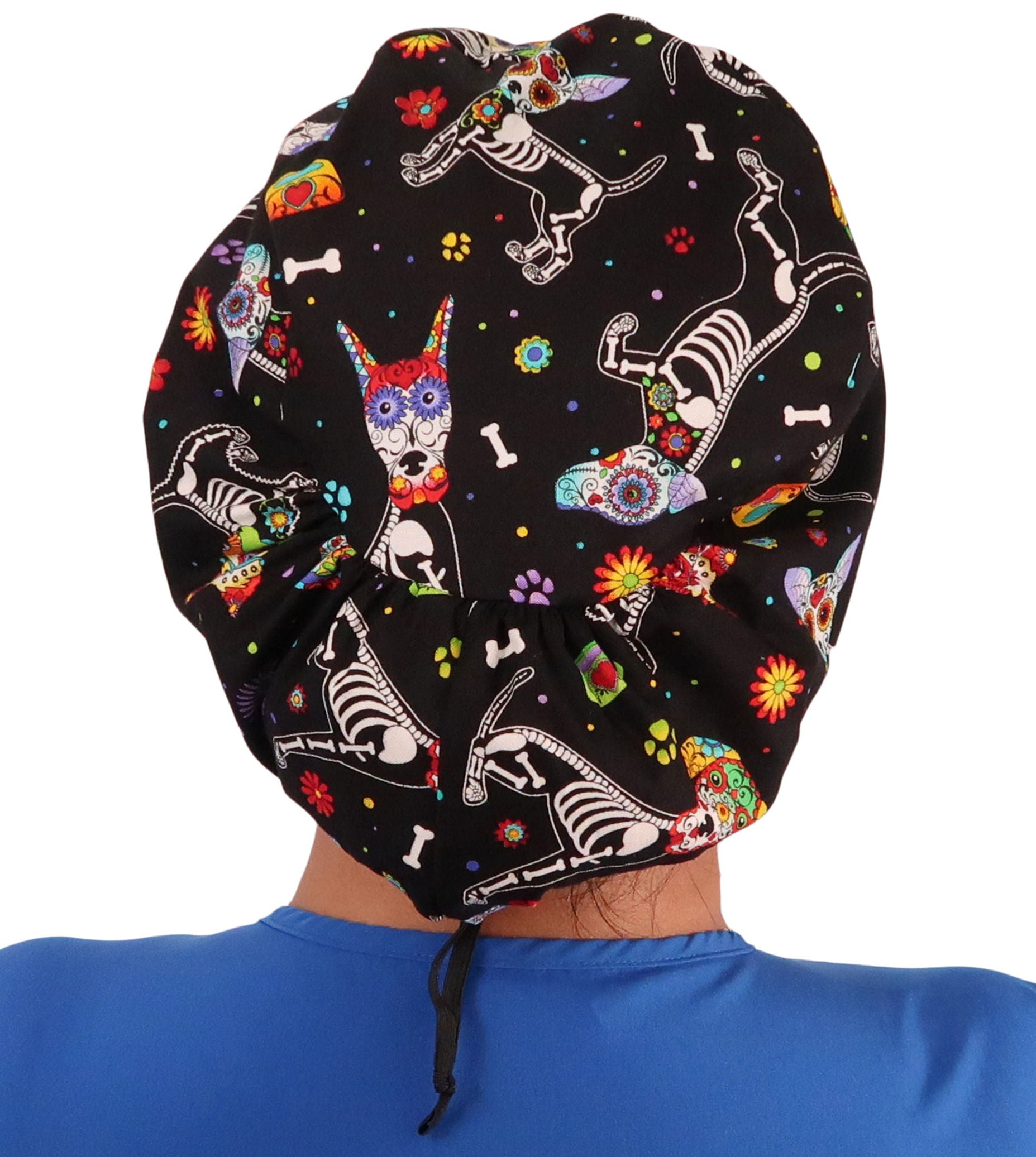 Back facing image of a woman in scrubs wearing a X - Ray Dogs Euro Style Riley Comfort Scrub Cap.