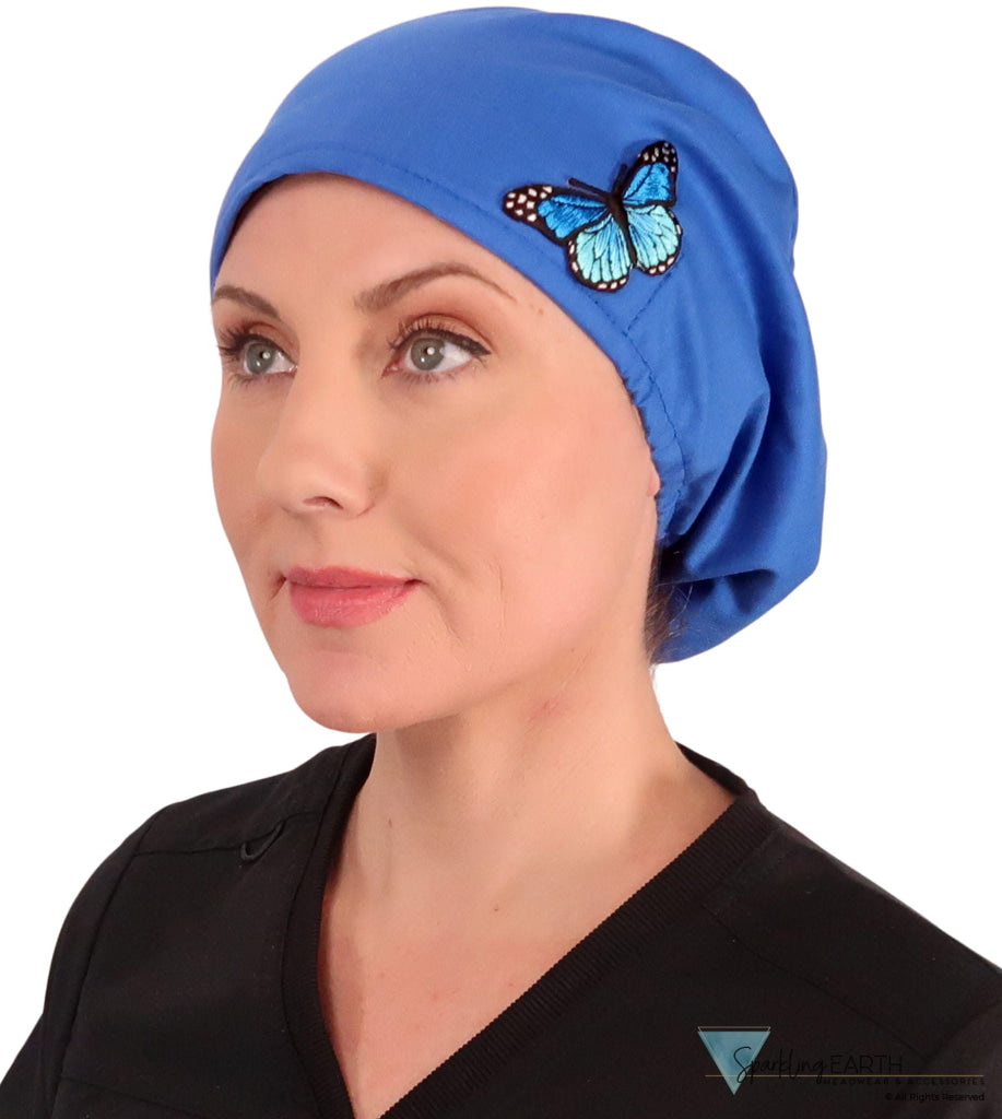 Embellished Euro Style Riley Comfort Scrub Cap - American Made - Blue Butterfly Patch on Royal Riley Comfort Scrub Caps