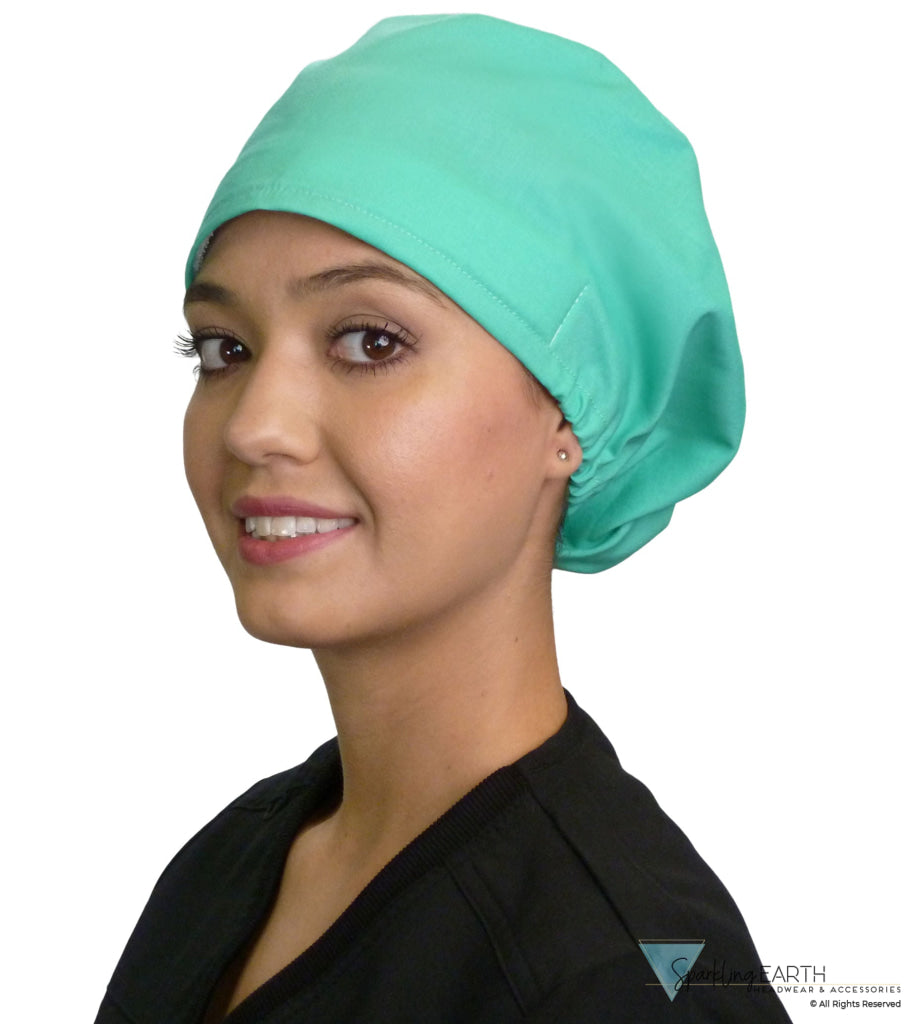 Front facing image of a woman in scrubs wearing a Scrub Green Euro Style Riley Comfort Scrub Cap.