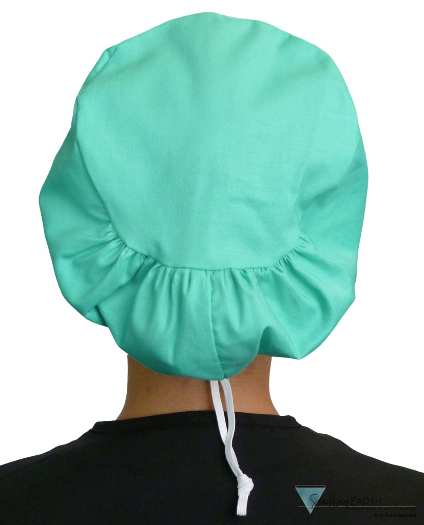 Back facing image of a woman in scrubs wearing a Scrub Green Euro Style Riley Comfort Scrub Cap.
