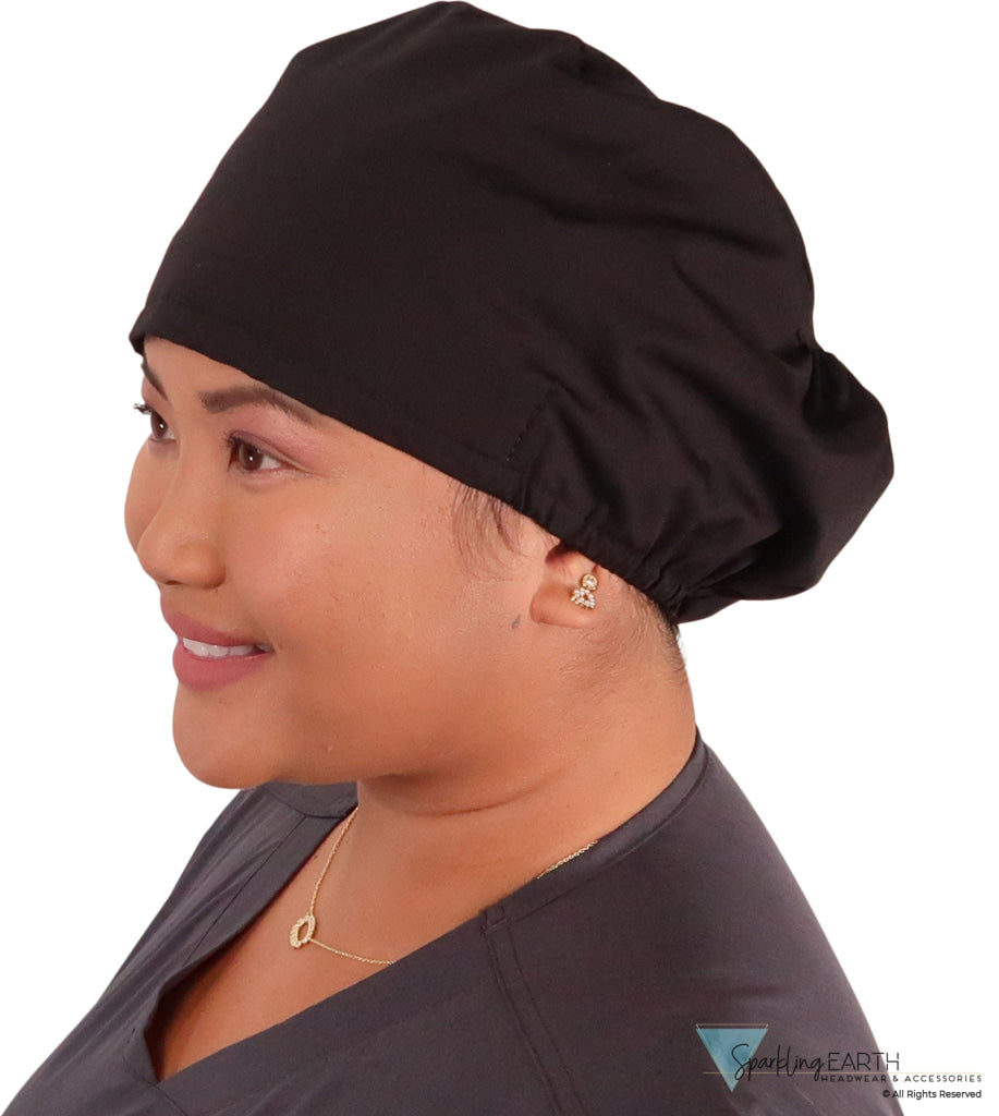 Side facing image of a woman in scrubs wearing a Black Euro Style Riley Comfort Scrub Cap.