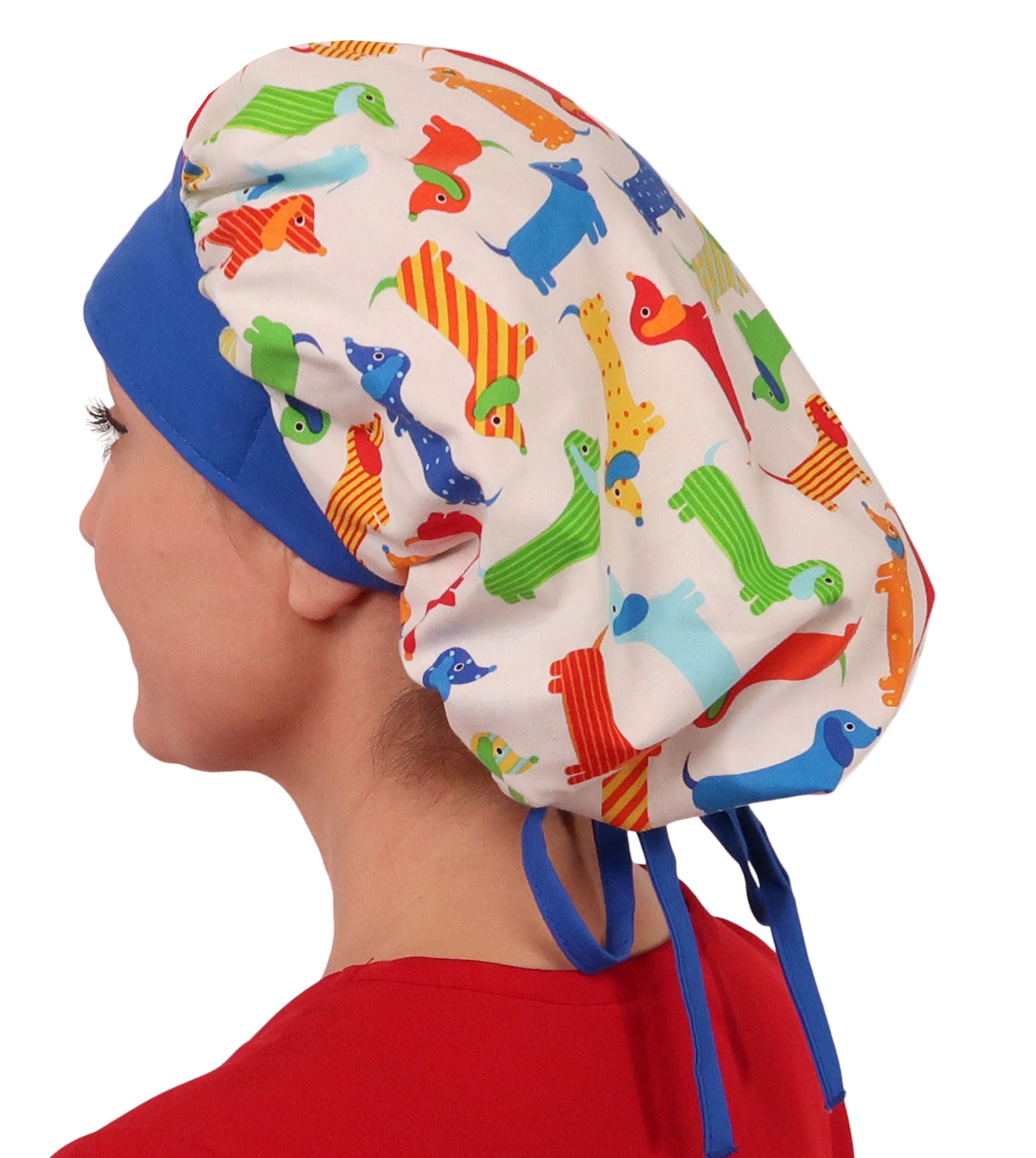 Side Facing Untied View of a Woman Wearing a Banded Bouffant Ponytail Surgical Scrub Cap - Wiener Dogs Pattern with a Royal Band and Ties   