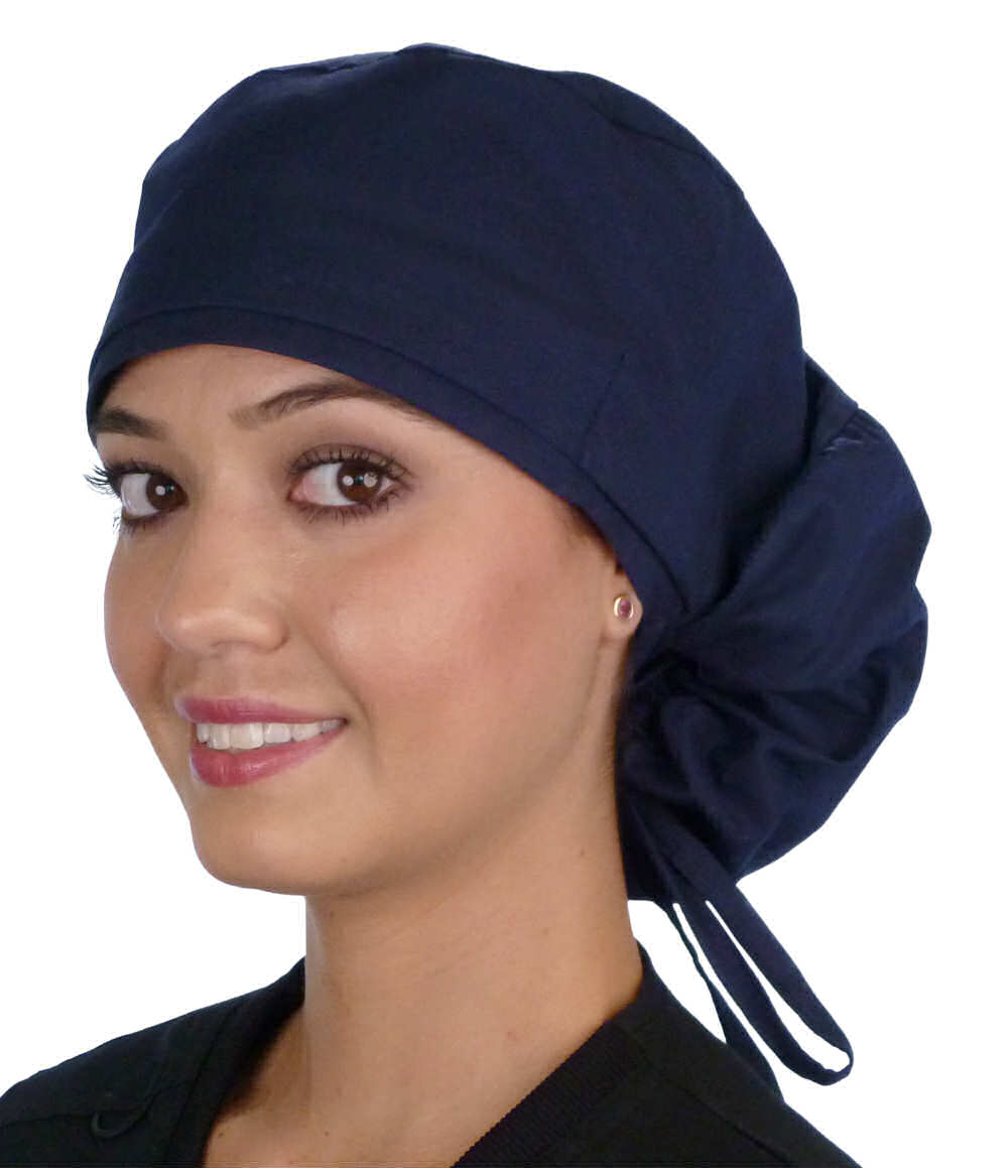 Front facing untied image of a woman in scrubs wearing a Navy Big Hair Ponytail Scrub Cap and navy ties to hold the scrub cap in place.